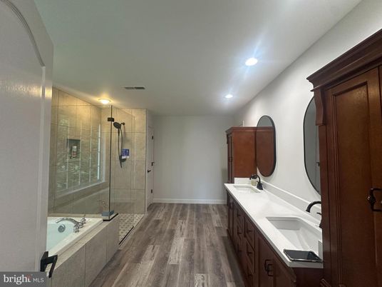 Bathroom, Dual Sink Vanities, Glass Shower, Interior, Recessed Lighting, Wood Texture Flooring