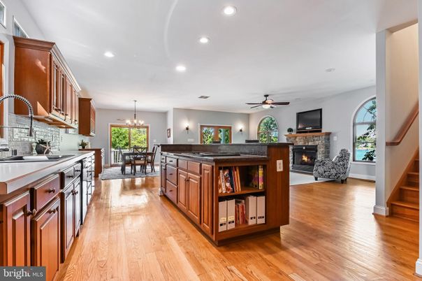 Chandelier, Dining room, Fireplace, Interior, Kitchen, Recessed Lighting, Wood Texture Flooring