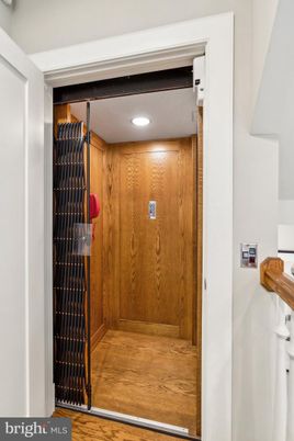 Elevator, Interior, Recessed Lighting, Wood Texture Flooring, Wooden Walls