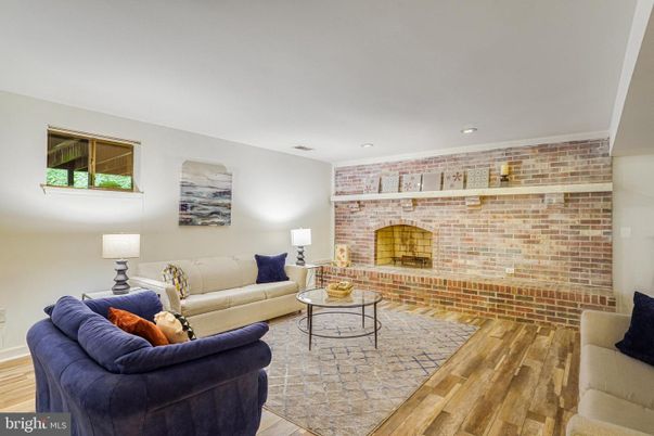Fireplace, Interior, Living room, Recessed Lighting, Stone Walls, Wood Texture Flooring