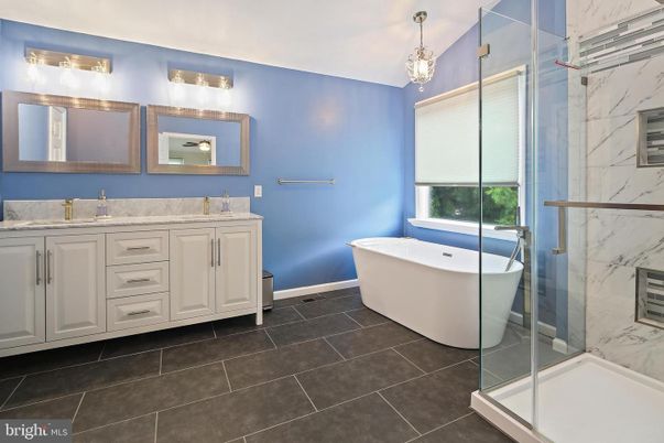 Bathroom, Dual Sink Vanities, Free Standing Baths, Glass Shower, Interior, Marble Walls, Pendant Lights