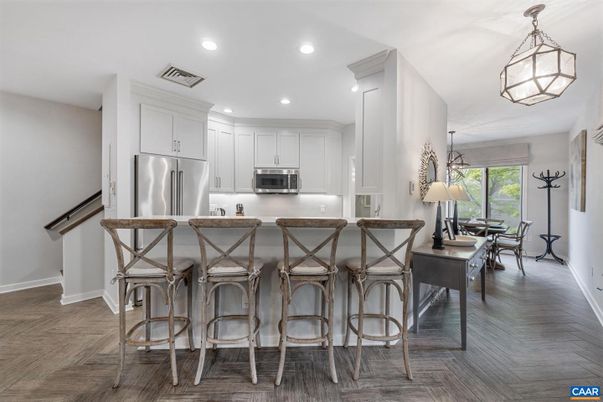 Dining room, Interior, Kitchen, Pendant Lights, Recessed Lighting, Stainless Steel Appliances, Wood Texture Flooring