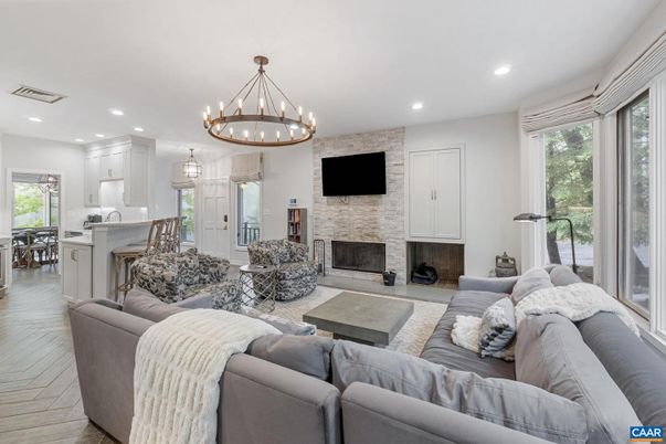 Chandelier, Fireplace, Interior, Kitchen, Living room, Recessed Lighting, Stone Walls, Wood Texture Flooring