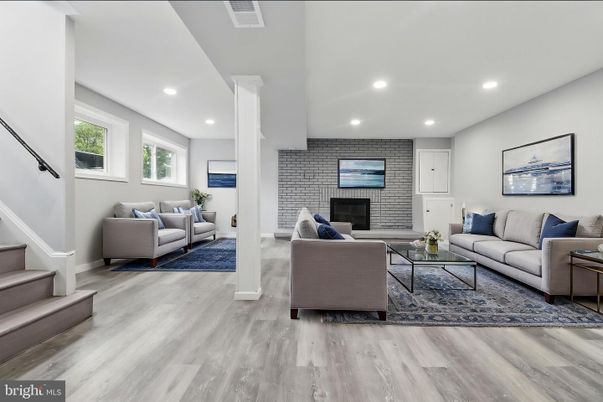 Fireplace, Interior, Living room, Recessed Lighting, Stone Walls, Wood Texture Flooring