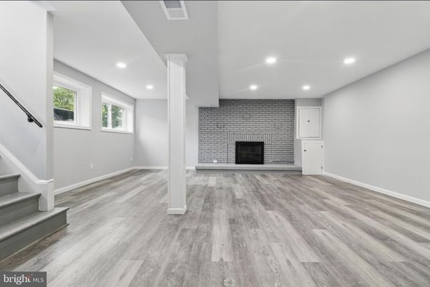 Empty room, Fireplace, Interior, Recessed Lighting, Stone Walls, Wood Texture Flooring