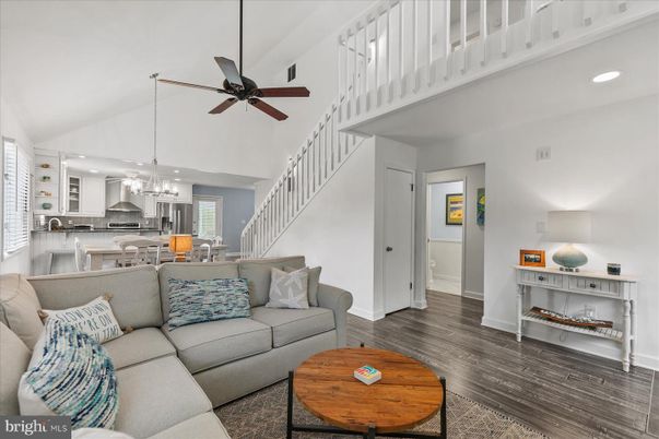 Chandelier, Interior, Kitchen, Living room, Pendant Lights, Recessed Lighting, Stainless Steel Appliances, Wood Texture Flooring