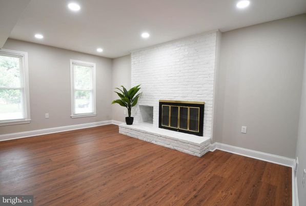 Empty room, Fireplace, Interior, Recessed Lighting, Stone Walls, Wood Texture Flooring