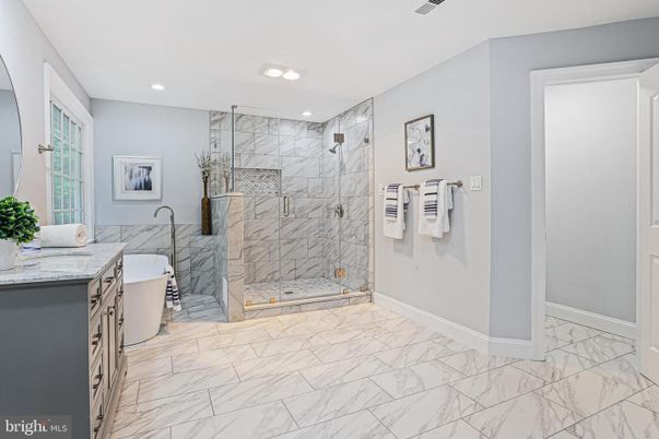 Bathroom, Free Standing Baths, Glass Shower, Interior, Marble, Marble Walls, Recessed Lighting