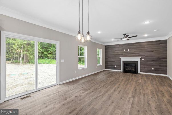 Empty room, Fireplace, Interior, Pendant Lights, Recessed Lighting, Wood Texture Flooring, Wooden Walls
