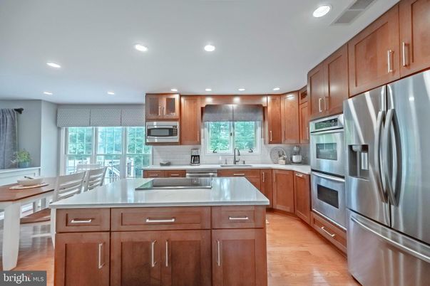 Dining room, Interior, Kitchen, Recessed Lighting, Stainless Steel Appliances, Wood Texture Flooring