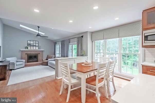 Dining room, Fireplace, Interior, Living room, Recessed Lighting, Wood Texture Flooring