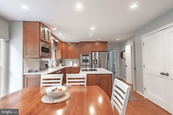 Dining room, Interior, Kitchen, Recessed Lighting, Stainless Steel Appliances, Wood Texture Flooring