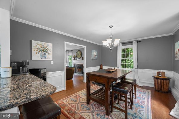 Chandelier, Dining room, Fireplace, Interior, Wood Texture Flooring