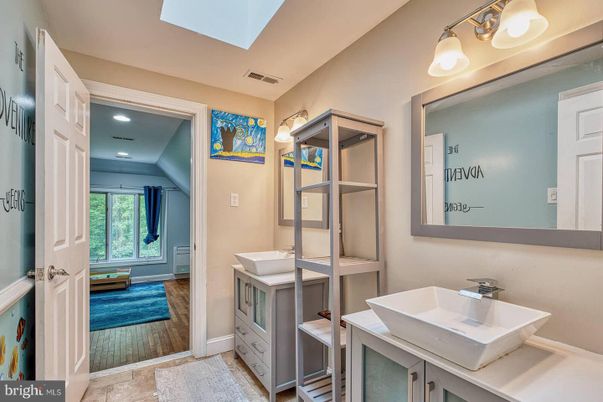Bathroom, Dual Sink Vanities, Interior, Recessed Lighting, Wood Texture Flooring