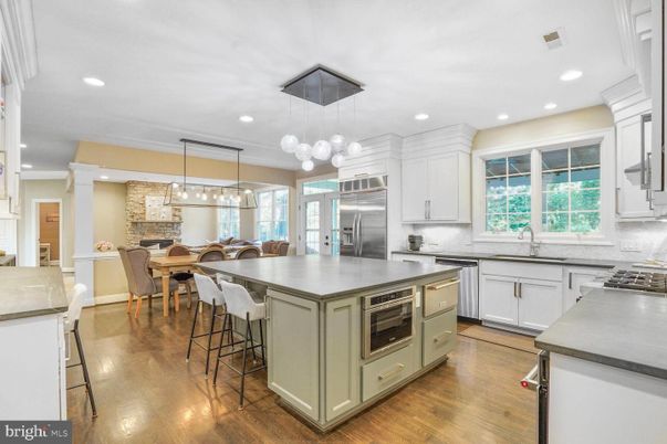 Dining room, Fireplace, Interior, Kitchen, Pendant Lights, Recessed Lighting, Stainless Steel Appliances, Wood Texture Flooring