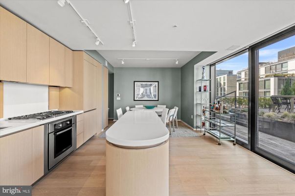 Dining room, Interior, Kitchen, Recessed Lighting, Stainless Steel Appliances, Wood Texture Flooring