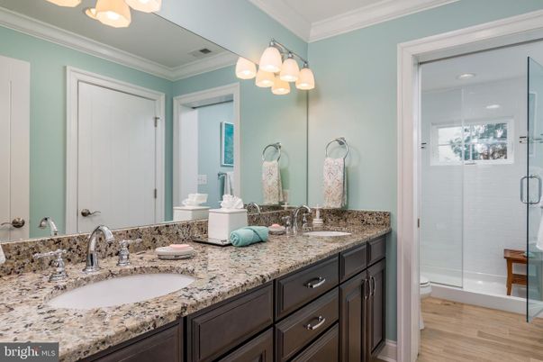 Bathroom, Dual Sink Vanities, Glass Shower, Interior, Recessed Lighting, Wood Texture Flooring