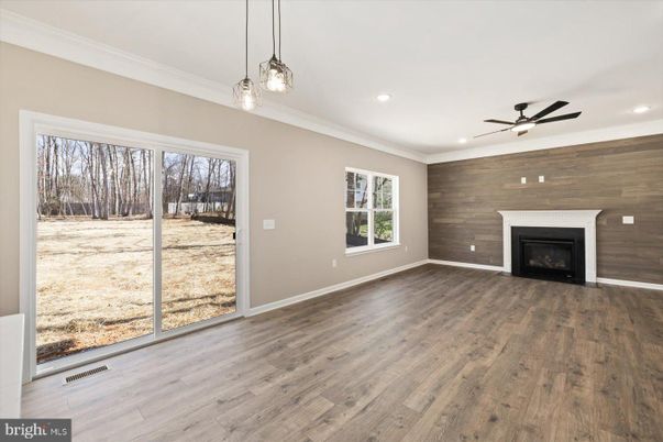 Empty room, Fireplace, Interior, Pendant Lights, Recessed Lighting, Wood Texture Flooring, Wooden Walls