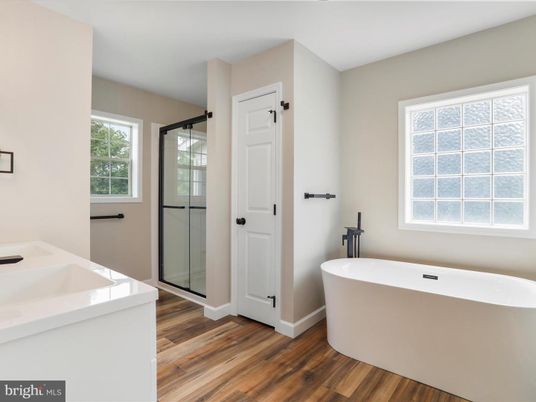 Bathroom, Dual Sink Vanities, Free Standing Baths, Glass Shower, Interior, Wood Texture Flooring