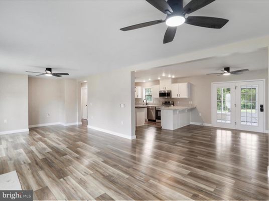 Empty room, Interior, Kitchen, Pendant Lights, Stainless Steel Appliances, Wood Texture Flooring