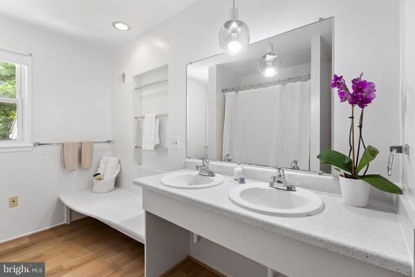 Bathroom, Dual Sink Vanities, Interior, Pendant Lights, Recessed Lighting, Wood Texture Flooring