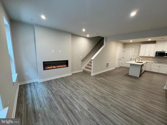 Empty room, Fireplace, Interior, Kitchen, Recessed Lighting, Wood Texture Flooring
