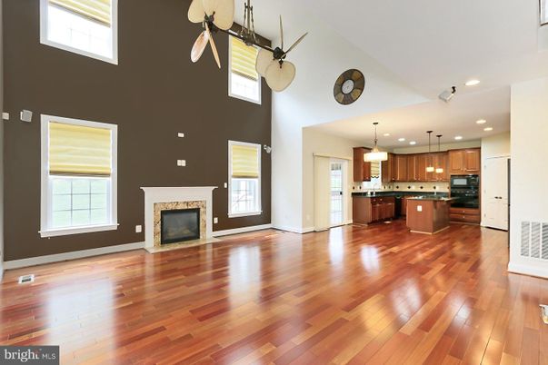 Empty room, Fireplace, Interior, Kitchen, Pendant Lights, Recessed Lighting, Wood Texture Flooring