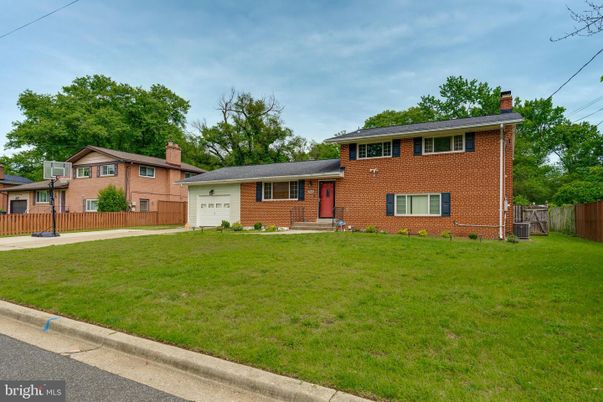 Attached, Backyard, Exterior, Facade, Brick Facade, Split Level