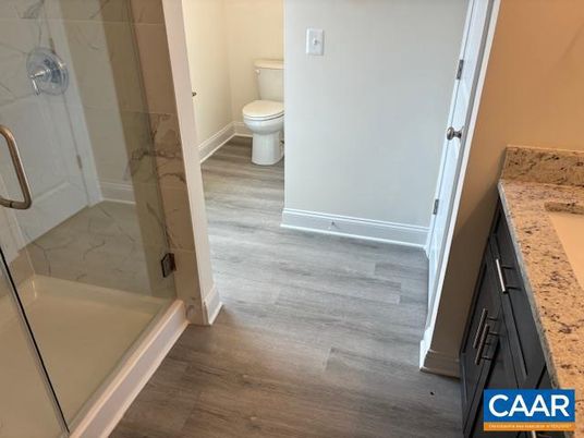 Bathroom, Glass Shower, Interior, Marble Walls, Wood Texture Flooring