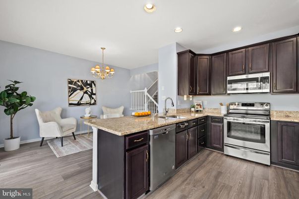 Chandelier, Interior, Kitchen, Recessed Lighting, Stainless Steel Appliances, Wood Texture Flooring