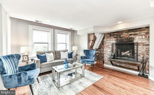 Fireplace, Interior, Living room, Recessed Lighting, Stone Walls, Wood Texture Flooring