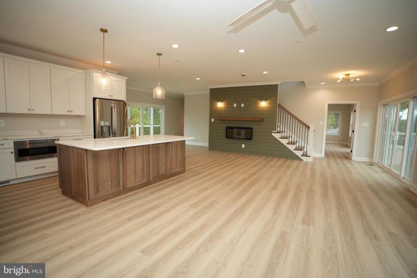 Fireplace, Interior, Kitchen, Pendant Lights, Recessed Lighting, Stainless Steel Appliances, Wood Texture Flooring