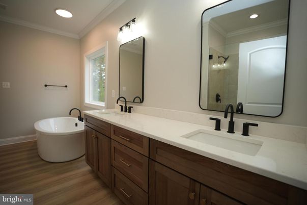 Bathroom, Dual Sink Vanities, Free Standing Baths, Interior, Recessed Lighting, Wood Texture Flooring