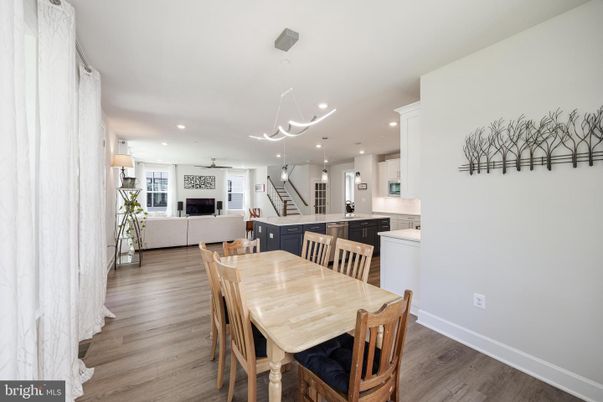 Dining room, Fireplace, Interior, Kitchen, Living room, Pendant Lights, Recessed Lighting, Stainless Steel Appliances, Wood Texture Flooring