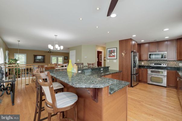 Chandelier, Dining room, Interior, Kitchen, Recessed Lighting, Stainless Steel Appliances, Wood Texture Flooring