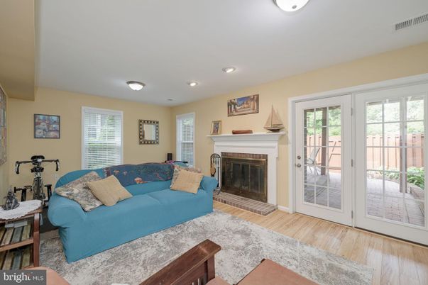 Fireplace, Fitness Equipment, Interior, Living room, Recessed Lighting, Wood Texture Flooring