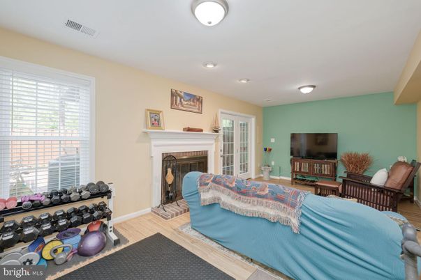 Bedroom, Fireplace, Fitness Equipment, Interior, Recessed Lighting, Wood Texture Flooring