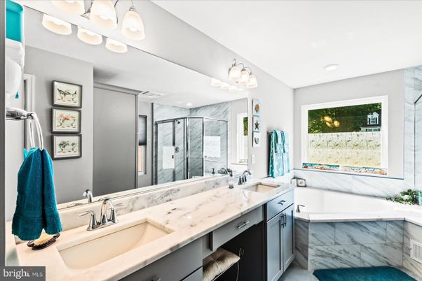 Bathroom, Dual Sink Vanities, Glass Shower, Interior, Marble Walls, Recessed Lighting