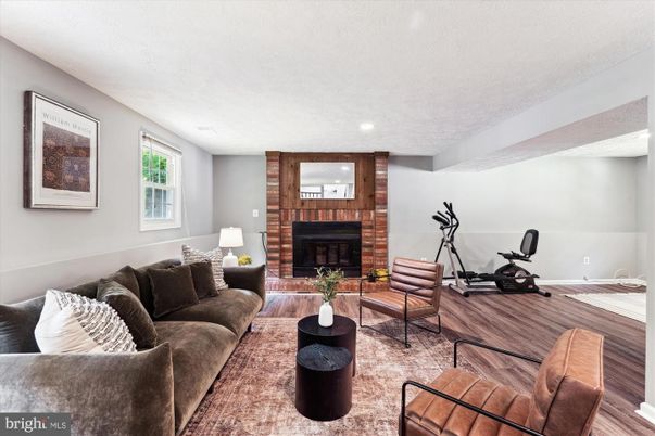Fireplace, Fitness Equipment, Interior, Living room, Recessed Lighting, Wood Texture Flooring