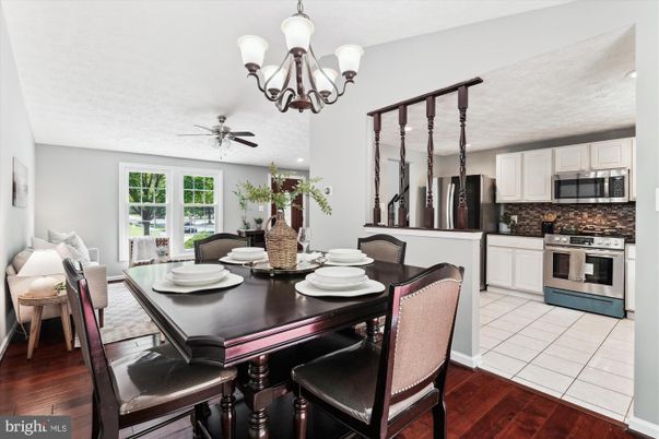 Chandelier, Dining room, Interior, Kitchen, Recessed Lighting, Stainless Steel Appliances, Wood Texture Flooring