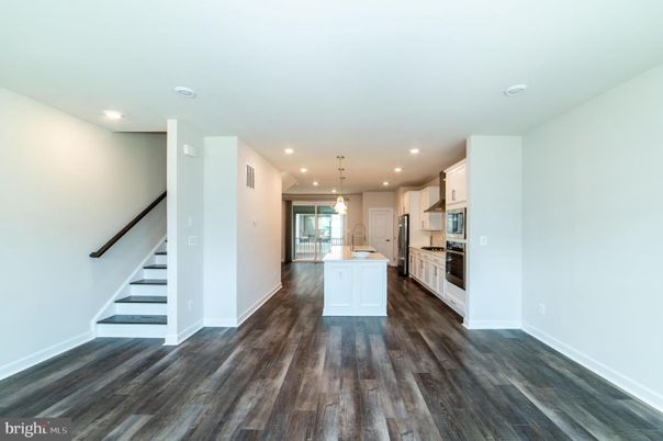 Empty room, Interior, Kitchen, Pendant Lights, Recessed Lighting, Stainless Steel Appliances, Wood Texture Flooring