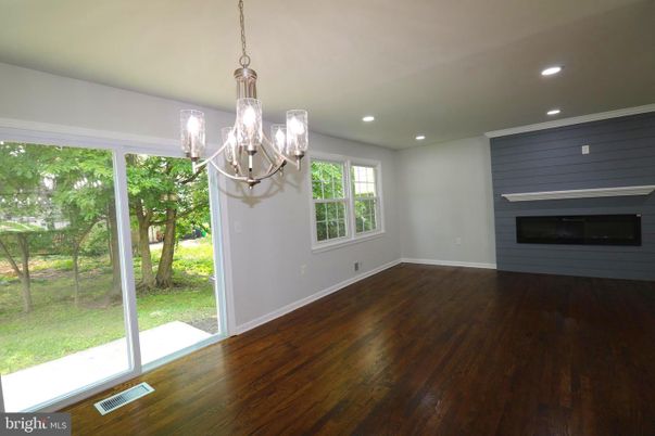 Chandelier, Empty room, Fireplace, Interior, Recessed Lighting, Wood Texture Flooring