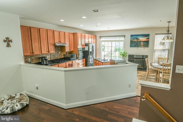 Dining room, Fireplace, Interior, Kitchen, Pendant Lights, Recessed Lighting, Wood Texture Flooring