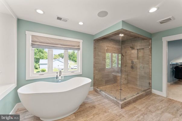 Bathroom, Free Standing Baths, Glass Shower, Interior, Recessed Lighting, Wood Texture Flooring