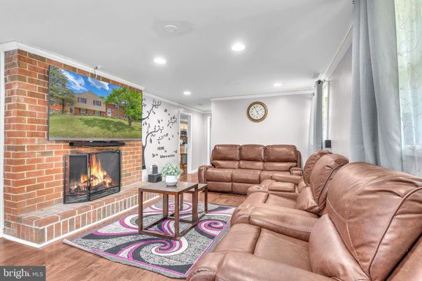 Fireplace, Interior, Living room, Recessed Lighting, Stone Walls, Wood Texture Flooring