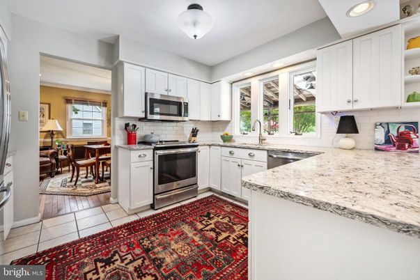 Dining room, Interior, Kitchen, Recessed Lighting, Stainless Steel Appliances, Wood Texture Flooring