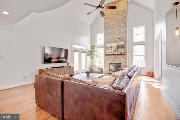 Fireplace, Interior, Living room, Pendant Lights, Recessed Lighting, Stone Walls, Wood Texture Flooring