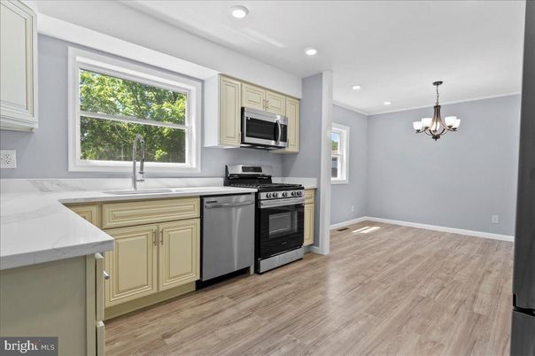 Chandelier, Interior, Kitchen, Recessed Lighting, Stainless Steel Appliances, Wood Texture Flooring