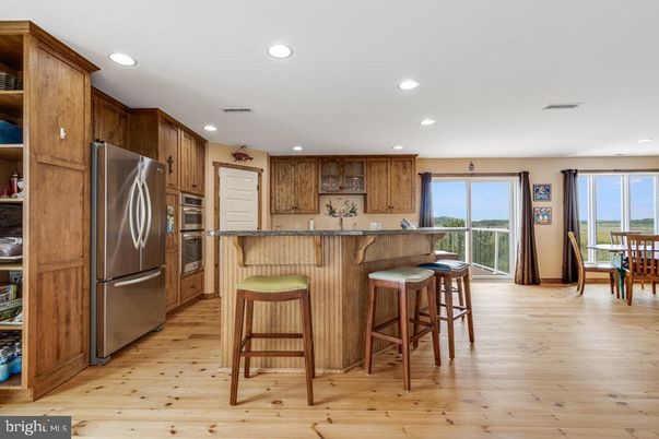 Dining room, Interior, Kitchen, Recessed Lighting, Stainless Steel Appliances, Wood Texture Flooring