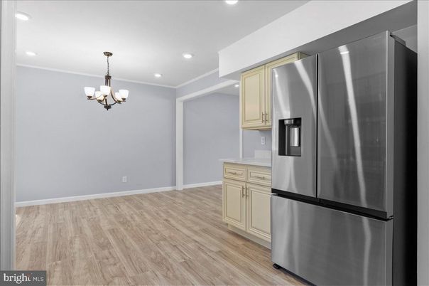 Chandelier, Empty room, Interior, Kitchen, Recessed Lighting, Stainless Steel Appliances, Wood Texture Flooring